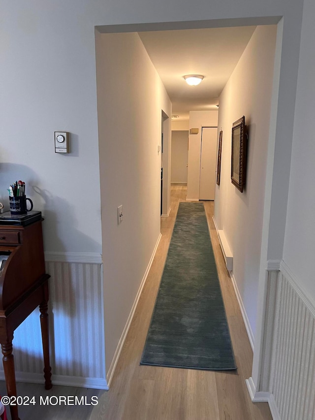 hallway featuring hardwood / wood-style flooring