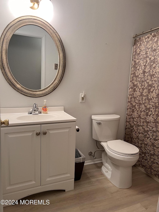 8A Fallbrook St, Whiting, NJ 08759 - bathroom featuring wood finished floors, toilet, vanity, baseboards, and curtained shower