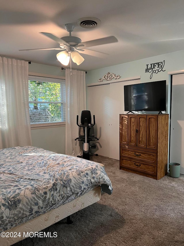 carpeted bedroom featuring ceiling fan