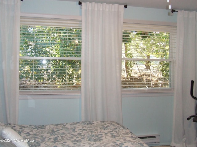 bedroom featuring a baseboard radiator