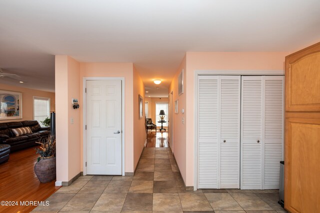 hallway featuring tile patterned flooring