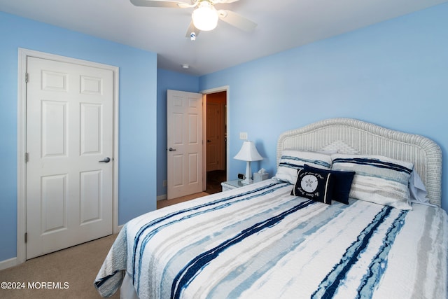 carpeted bedroom with ceiling fan