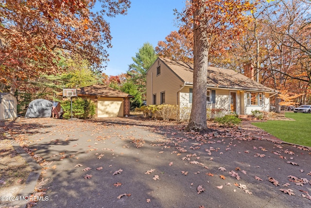 view of front of home with an outbuilding and a garage