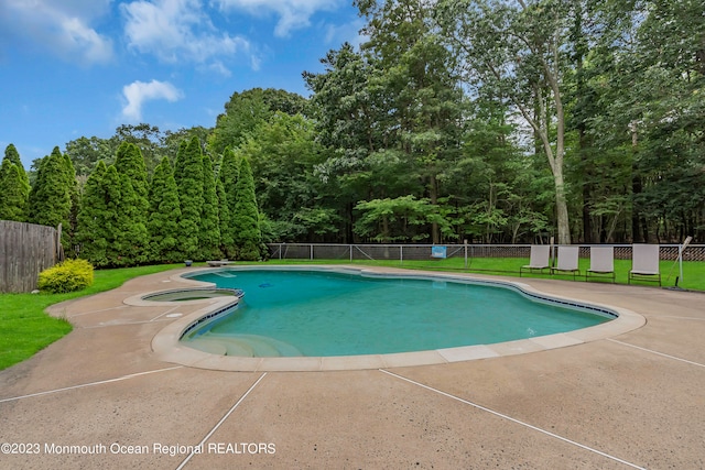 view of pool featuring a yard