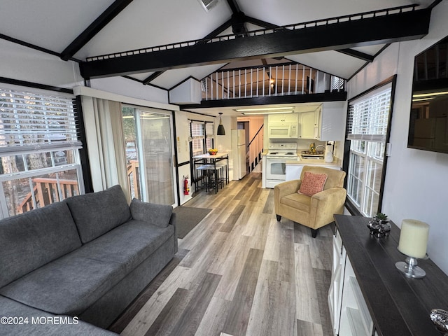 living room featuring high vaulted ceiling, light hardwood / wood-style flooring, and beam ceiling