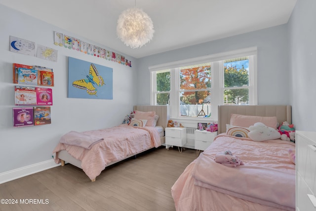 bedroom with wood-type flooring