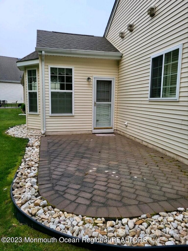 rear view of property featuring a patio