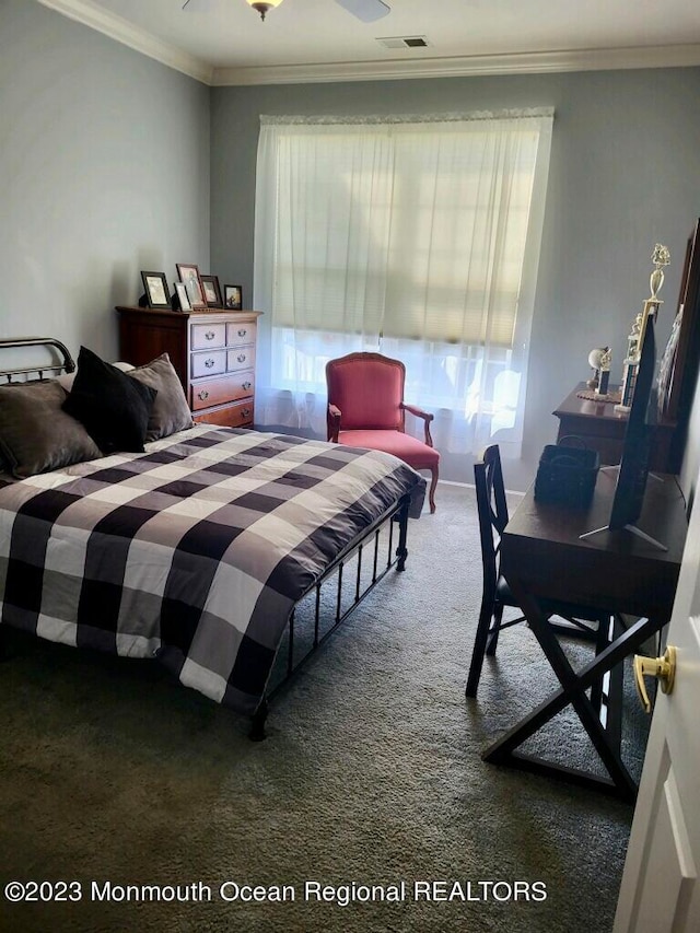 carpeted bedroom featuring crown molding and ceiling fan