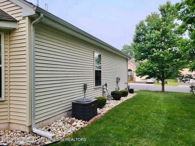 view of home's exterior featuring a lawn