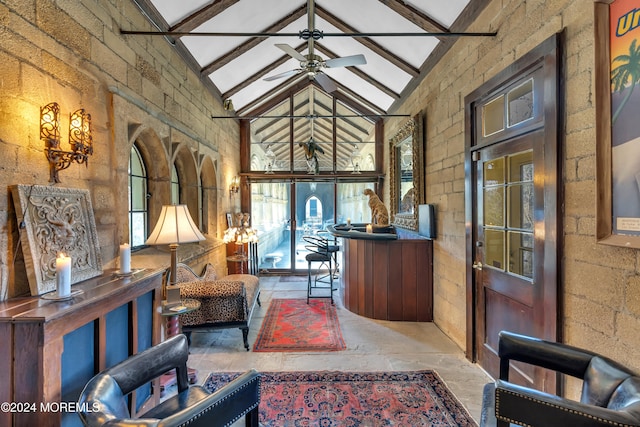 interior space featuring ceiling fan, beam ceiling, and high vaulted ceiling