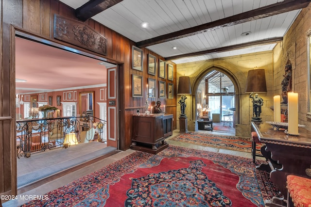 foyer with beamed ceiling and wood ceiling