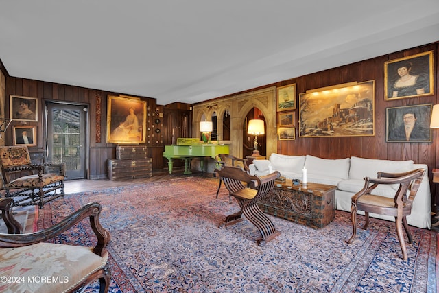 living room featuring wooden walls