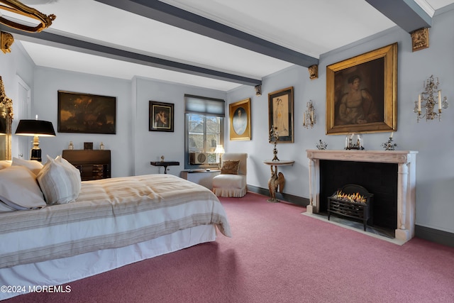 bedroom featuring carpet floors and beam ceiling