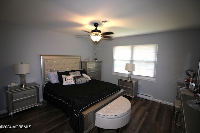 bedroom with dark wood-type flooring, ceiling fan, and a baseboard heating unit