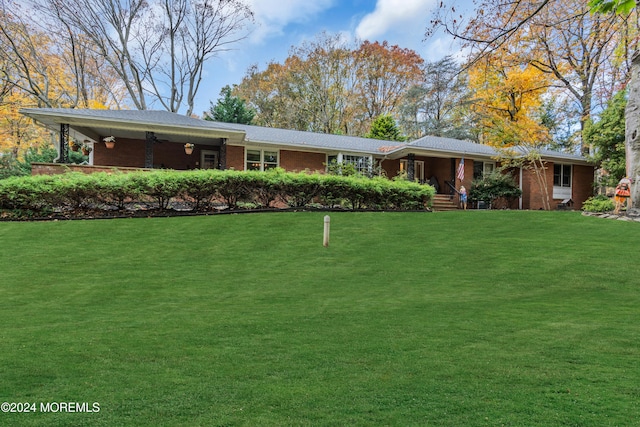 ranch-style home featuring a front yard