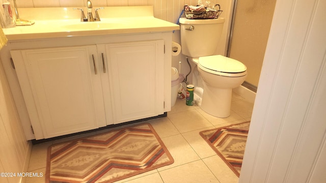 bathroom with vanity, tile patterned floors, and toilet