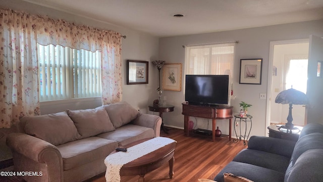 living room with dark wood-type flooring