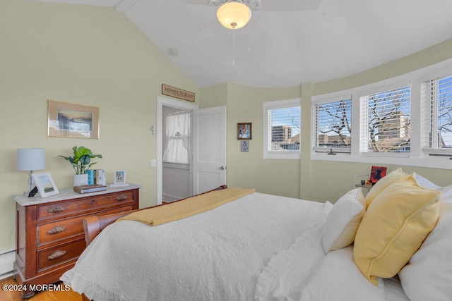 bedroom featuring hardwood / wood-style floors and lofted ceiling