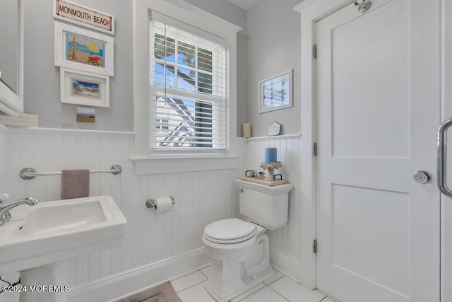 bathroom featuring tile patterned flooring and toilet