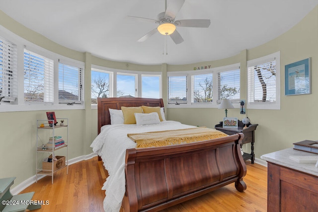 bedroom with ceiling fan and light hardwood / wood-style flooring