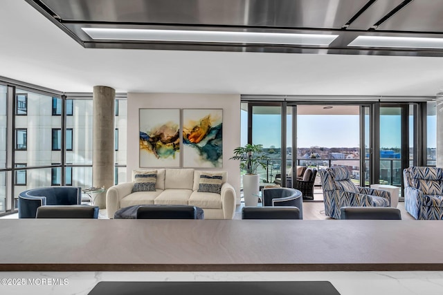 living room with floor to ceiling windows
