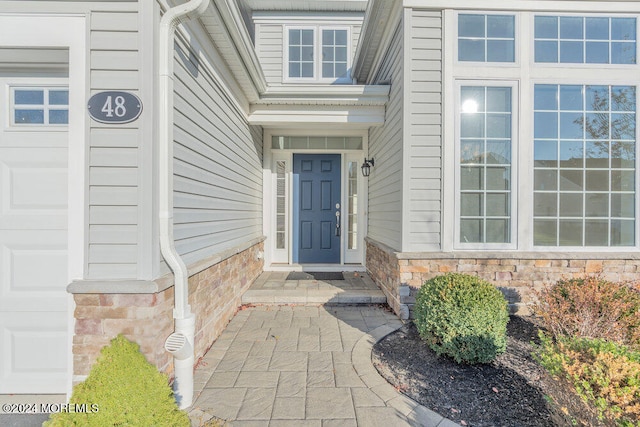 property entrance with a garage