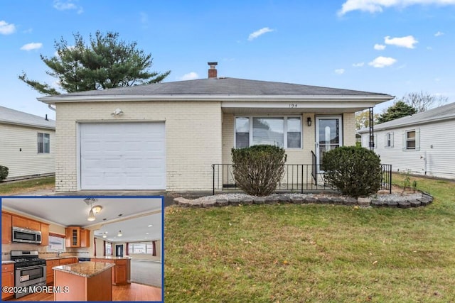 view of front of house featuring a garage and a front yard