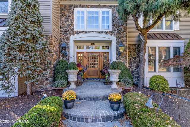 25 Bruns Rd, West Allenhurst, NJ 07711 - entrance to property with stone siding and a standing seam roof
