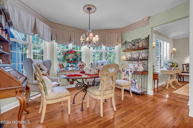 25 Bruns Rd, West Allenhurst, NJ 07711 - dining area with a chandelier, ornamental molding, wood finished floors, and baseboards