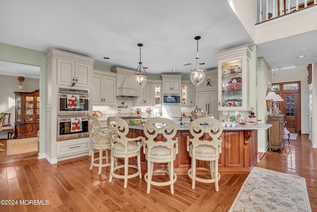 25 Bruns Rd, West Allenhurst, NJ 07711 - kitchen featuring black microwave, custom exhaust hood, double oven, light wood-type flooring, and recessed lighting