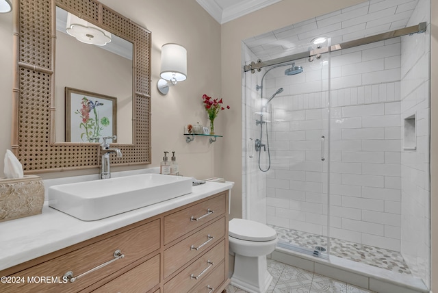 bathroom featuring tile patterned floors, ornamental molding, vanity, toilet, and a shower with shower door