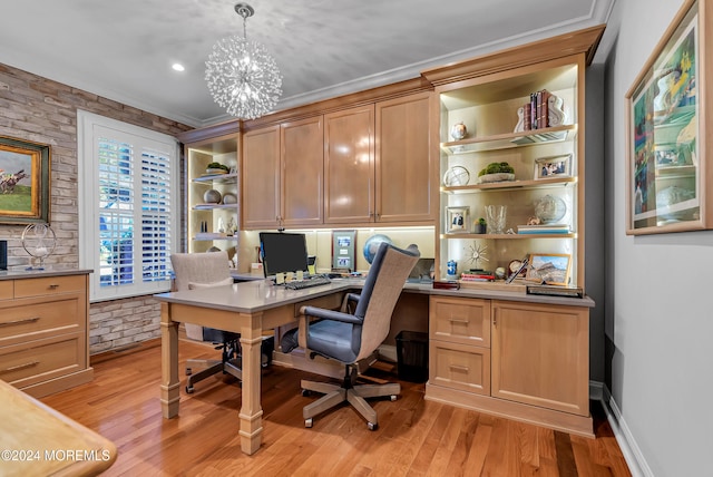 office space with ornamental molding, light hardwood / wood-style flooring, a notable chandelier, and brick wall