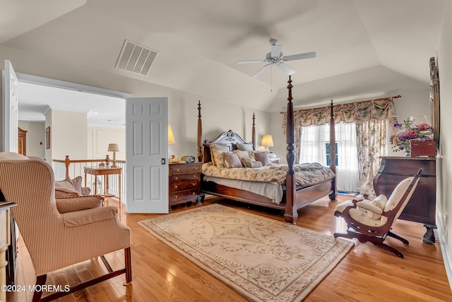 bedroom with light wood-type flooring, lofted ceiling, and ceiling fan