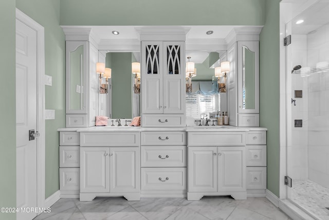 bathroom featuring ornamental molding, vanity, and a shower with door