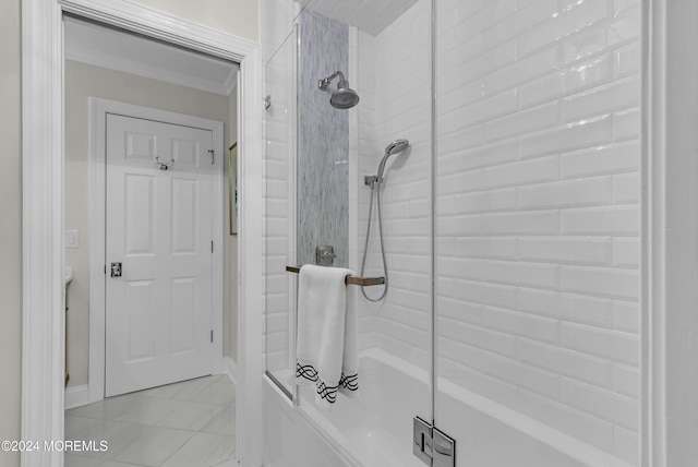 bathroom with an enclosed shower and tile patterned flooring