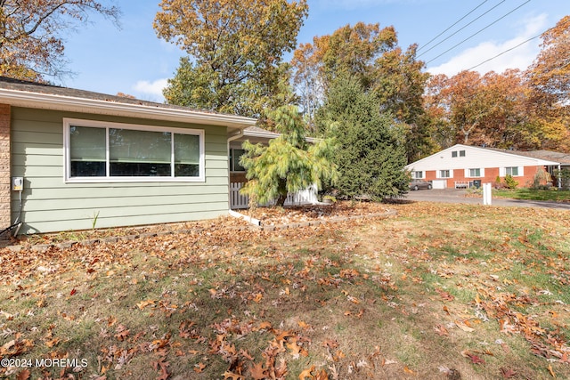 view of home's exterior featuring a lawn