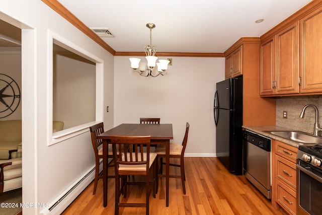 kitchen with ornamental molding, appliances with stainless steel finishes, sink, and light hardwood / wood-style floors