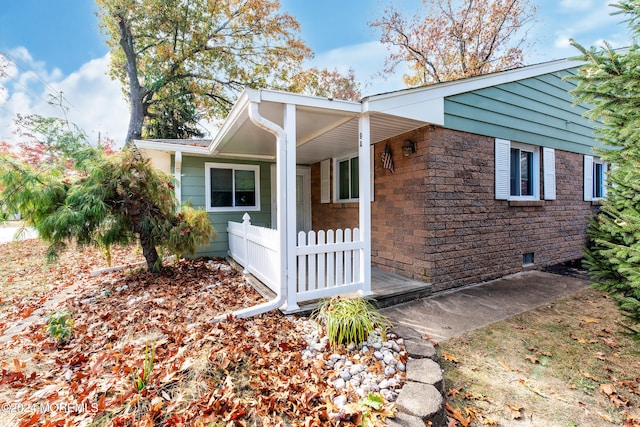 view of side of property with a porch