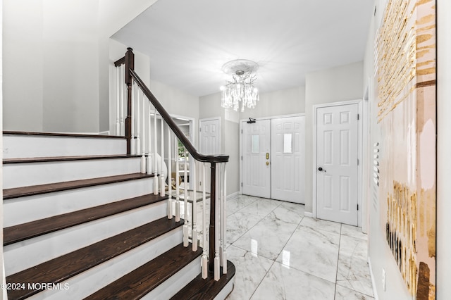 entryway featuring an inviting chandelier