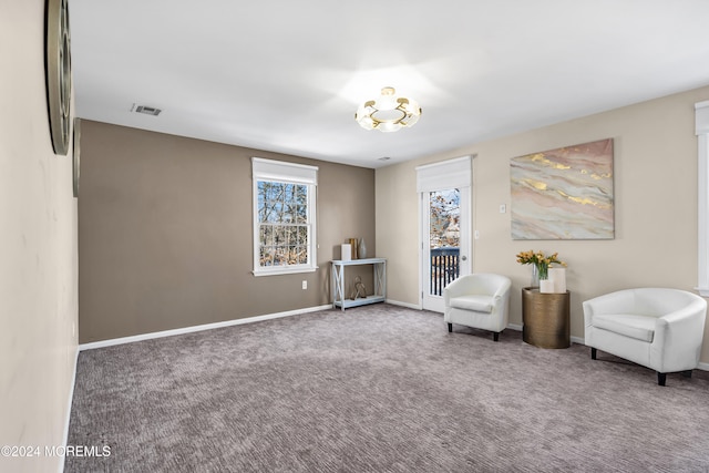 living area featuring carpet floors