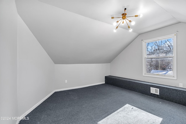 additional living space with carpet floors and lofted ceiling