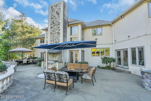 exterior space featuring french doors and an outdoor living space