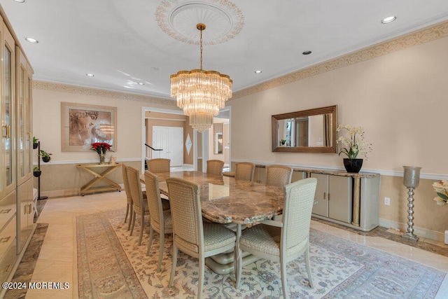 dining space featuring a notable chandelier and ornamental molding