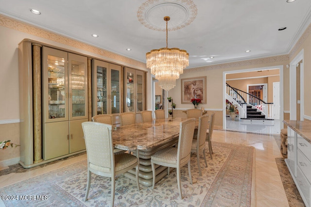 dining space with a chandelier and crown molding