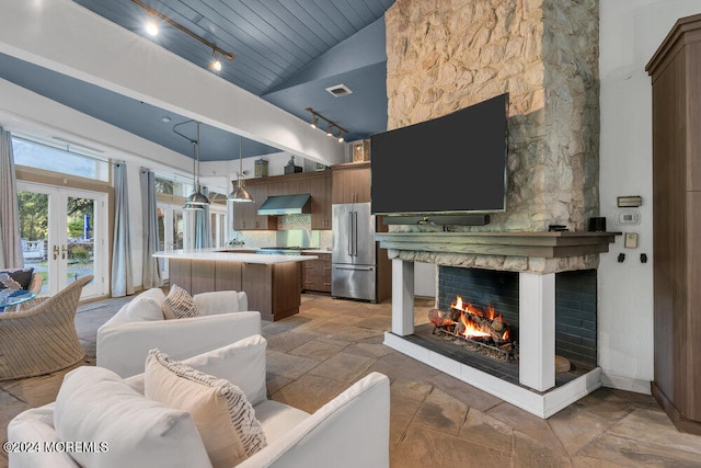 living room featuring high vaulted ceiling, french doors, wooden ceiling, and a fireplace