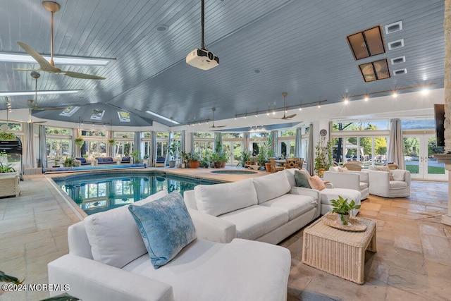 view of pool featuring ceiling fan, a patio, and an outdoor living space