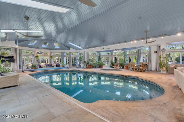 view of swimming pool featuring a lanai, ceiling fan, a patio, and an indoor in ground hot tub