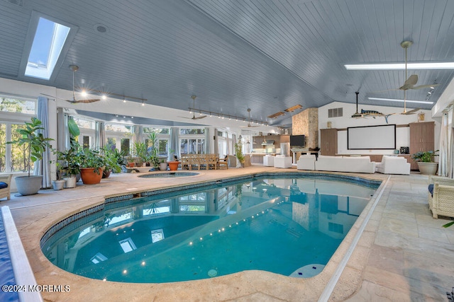 view of pool featuring a patio and an indoor hot tub