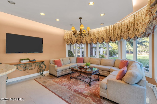 living room with baseboard heating, tile patterned floors, and an inviting chandelier