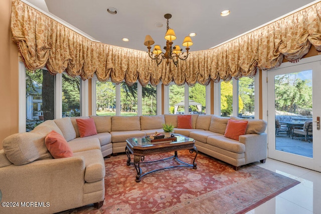 sunroom / solarium featuring a notable chandelier